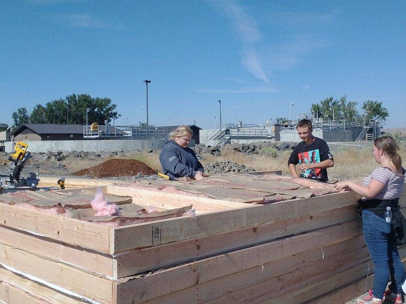 Volunteers insulating walls