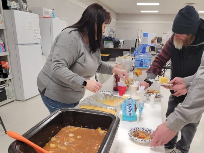 Volunteer serving guests at Sleep Center
